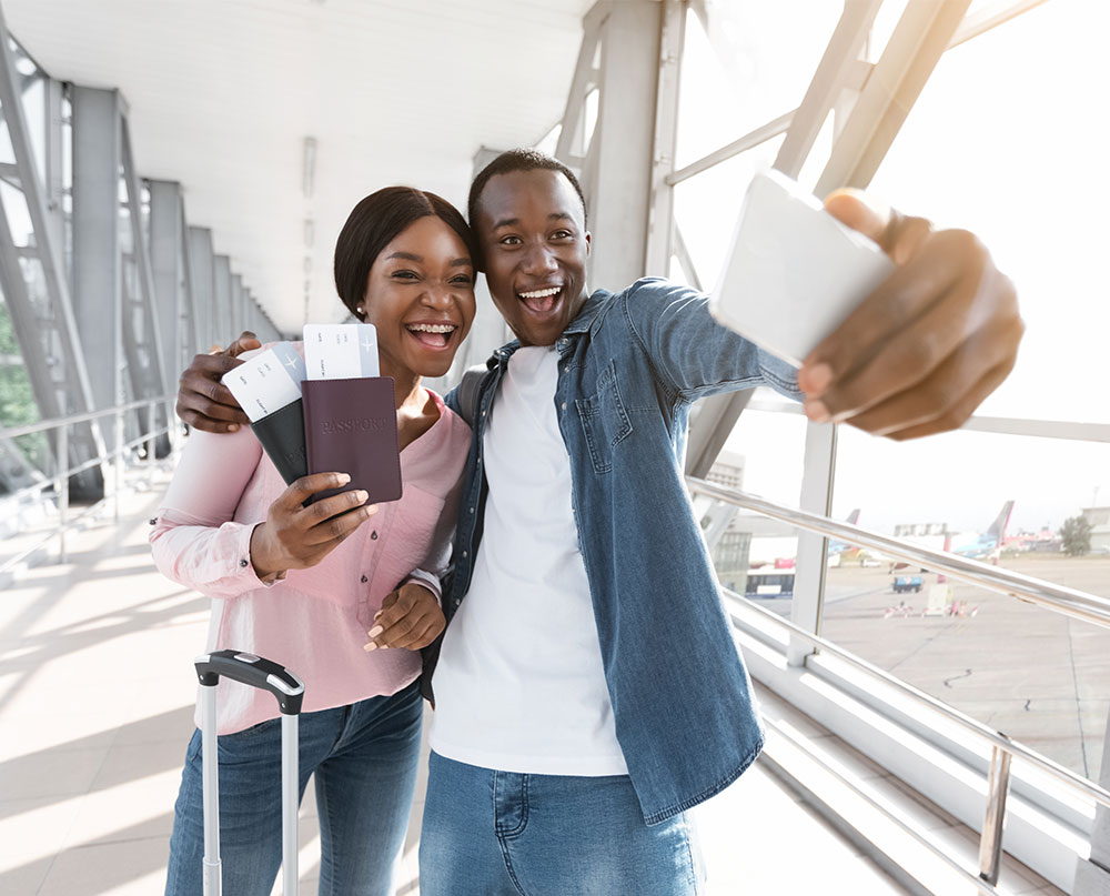 couple taking selfie at airport